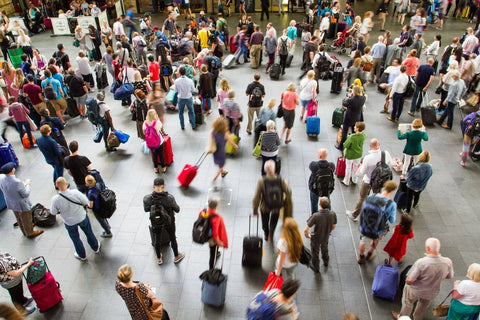 Busy train station with many travelers.