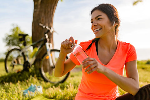 happy women stretching in the woods