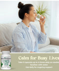 Woman drinking water with a supplement bottle labeled Stress Ease below.