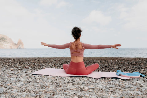 woman-sea-pilates-sporty-happy-middle-aged-woman-practicing